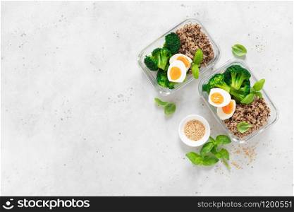 Lunch boxes with broccoli, quinoa and egg, healthy food, balanced eating concept, top view