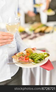 Lunch buffet at business meeting woman hold catering food plate