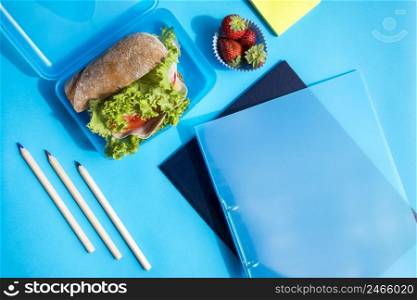 lunchbox with folders pencils