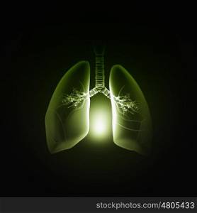 Lungs health. Male hand pointing on lung radiography on dark background