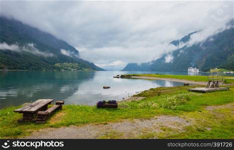 Lustrafjorden fjord and mountains summer cloudy landscape, Norway. Panorama.