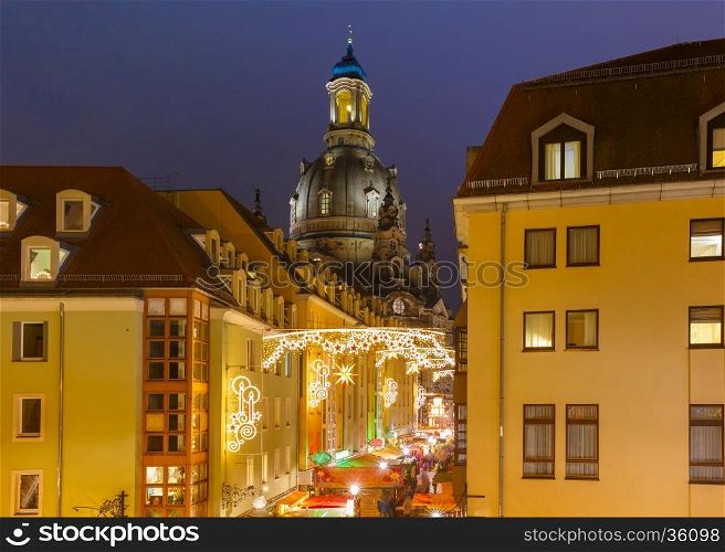 Lutheran church of Our Lady aka Frauenkirche with decorated and illuminated Christmas street at night in Dresden, Saxony, Germany