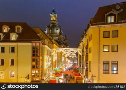 Lutheran church of Our Lady aka Frauenkirche with decorated and illuminated Christmas street at night in Dresden, Saxony, Germany