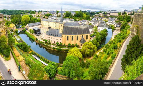 Luxembourg cityscape, ancient church on river, panorama. Old european architecture, medieval stone buildings. Luxembourg cityscape, church on river, panorama