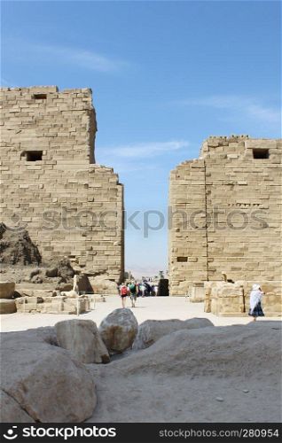 LUXOR / EGYPT - OCTOBER 13, 2012  Tourists among the ancient ruins of Karnak Temple