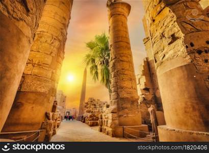 Luxor Karnak temple. The pylon with blue sky and pyramids