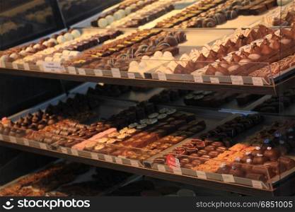 Luxurious Chocolates on display in a confectioner&rsquo;s shop (tags: price and product information in Dutch)