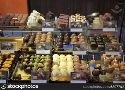 Luxurious Chocolates on display in a confectioner&rsquo;s shop (tags: price and product information in Dutch)