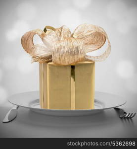 Luxurious gift on plate. Feast concept.