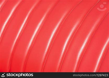 luxurious red leather vintage car seat upholstery in sunlight