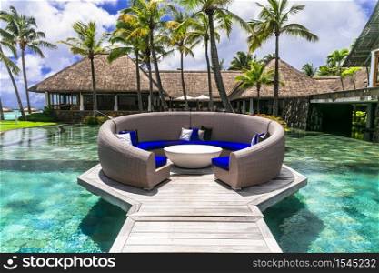 luxury 5 star resort territory with swimming pool and exotic bar - Constance Belle Mare Plage. Mauritius island. Pointe de flacq , Belle Mare. February 2020. Mauritius island holidays. Exotic hotel with beautiful modern territory