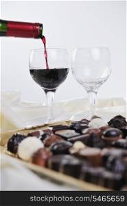 luxury and sweet praline and chocolate with wine bottle and glasses decoration