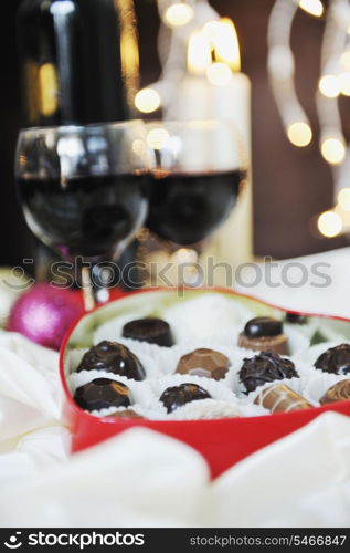 luxury and sweet praline and chocolate with wine bottle and glasses decoration