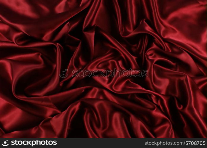 Luxury background of folded red silk