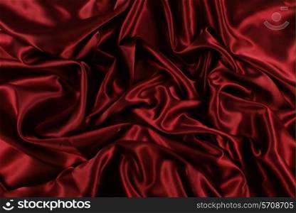 Luxury background of folded red silk