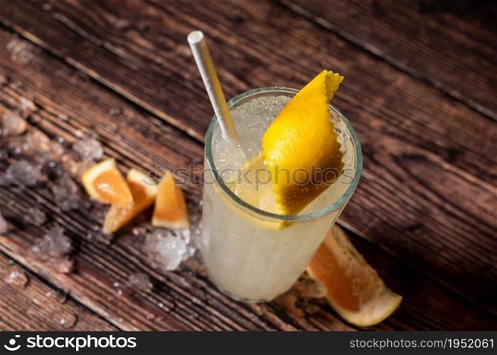Luxury cocktail and cocktail shaker on black stone background