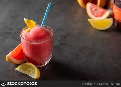 Luxury cocktail and cocktail shaker on black stone background