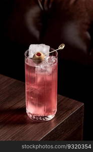 Luxury cocktail on the wooden table on a dark background