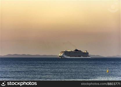 Luxury cruise ship arriving in the city of Salvador in Bahia during summer sunset. Luxury cruise ship arriving in the city of Salvador