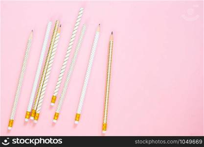 Luxury design pencil on pink pastel colour background