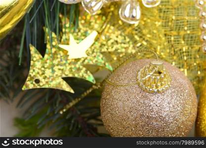 luxury gift boxes under Christmas tree, New Year home decorations, golden wrapping of Santa presents, festive fir tree decorated with garland, baubles set, traditional celebration