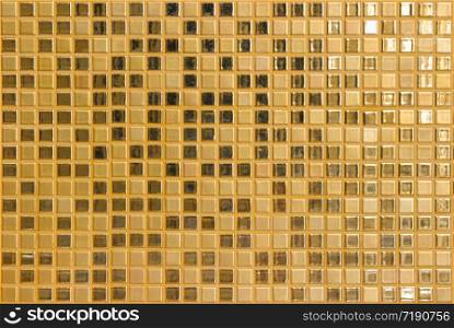 Luxury golden square shape tile pattern wall background.