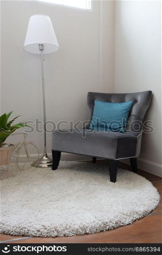luxury grey tweed sofa with blue pillow in living room
