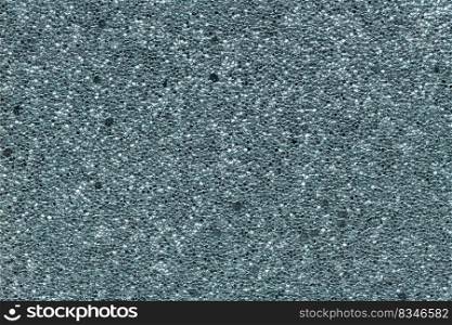 Luxury metallic blue background. Abstract texture scales with metallic blue sequins close-up. Glamor background with shiny sequins on fabric, macro.