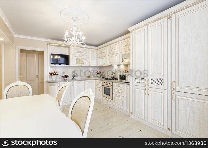 Luxury modern beige and cream colored kitchen in modern classic style.. Luxury modern beige and cream colored kitchen interior