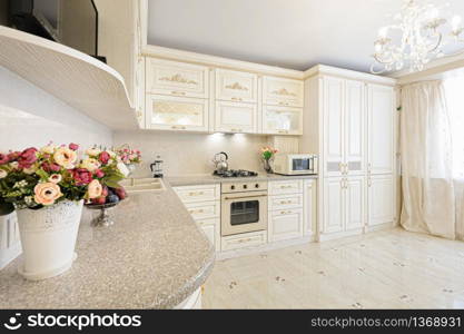 Luxury modern beige and cream colored kitchen in modern classic style.. Luxury modern beige and cream colored kitchen interior