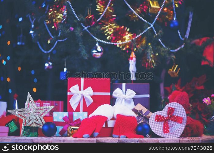 Luxury New Year gifts box, present boxes under Christmas tree in holiday, Christmastime celebration, home decorated with festive shiny balls, magic night
