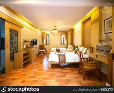 Luxury room with bed with vintage decoration, room of hotel resort in Thailand.