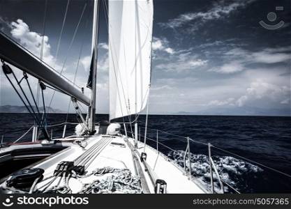 Luxury sail boat in the sea at evening, extreme water sport, yacht in action, summer transport, trip in the ocean, active holidays concept