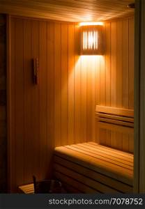 Luxury Sauna room with traditional sauna accessories