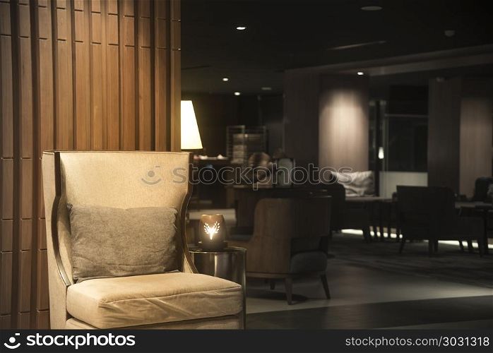 Luxury sofas in the hotel&rsquo;s guest lounge with night lighting.