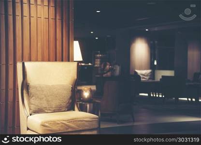 Luxury sofas in the hotel&rsquo;s guest lounge with night lighting.
