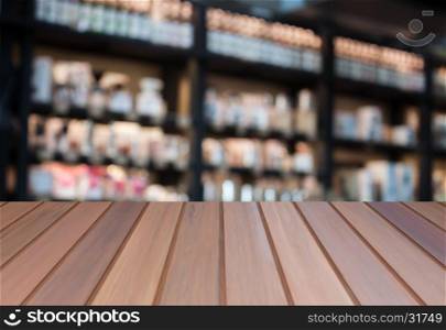 Luxury top wooden with blurred coffee shop background. product display template