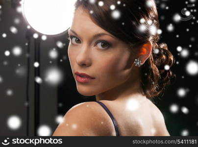 luxury, vip, nightlife, party, christmas, x-mas, new year&#39;s eve concept - beautiful woman in evening dress wearing diamond earrings