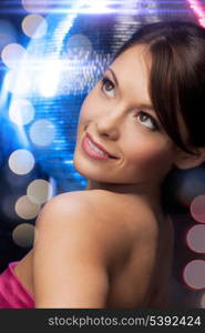 luxury, vip, nightlife, party, clubbing concept - beautiful woman in evening dress with disco ball