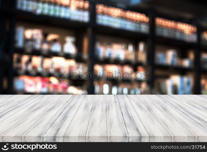 Luxury white wooden table top with blurred coffee shop background. product display template