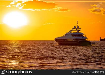 Luxury yacht on open sea at golden sunset, Zadar, Dalmatia, Croatia