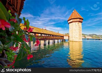 Luzern Chapel Bridge Tower and waterfront landmarks view, town in central Switzerland