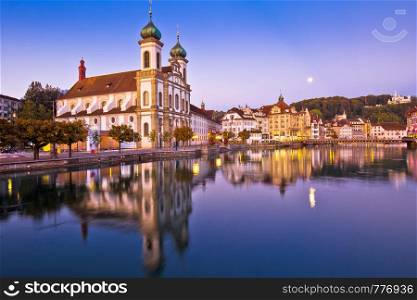 Luzern church and Reuss river waterfront dawn view, central Switzerland