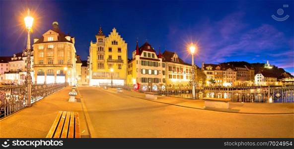 Luzern panoramic evening view of famous landmarks and Reuss river, central Switzerland