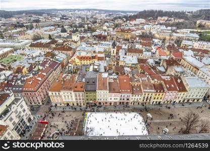 Lviv, Ukraine -10 January, 2020: Gorgeous Aerial view from the city hall of the Lviv city to the whole city and the market square.. Gorgeous Aerial view from the city hall of the Lviv city to the whole city and the market square.