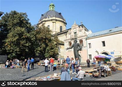 Lviv, Ukraine - September 08, 2016: Book Fair at the monument to Ivan Fedorov in Lviv, sunny autumn day. Ivan Fedorov (1525-1583) was the first printer in Russia and Ukraine.