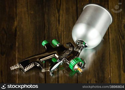 LVLP Air Spray Gun on wooden background