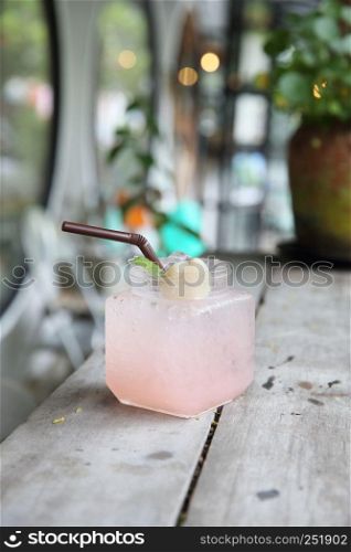 Lychee Juice on wood background