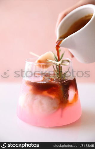 lychee juice with coffee in pink background