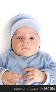 Lying baby boy at blue on a white background